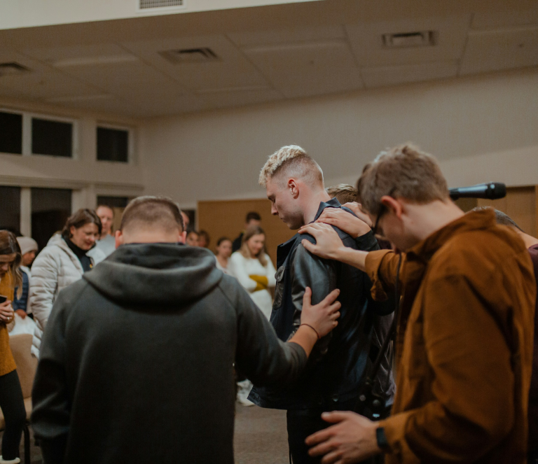 Group comforting man